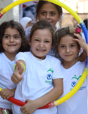 Children smiling with hoop
